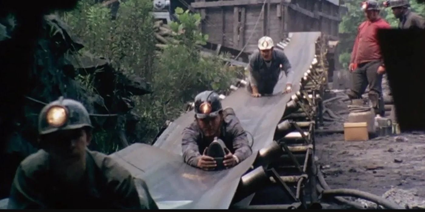Coal miners sliding down a chute in Harlan County USA
