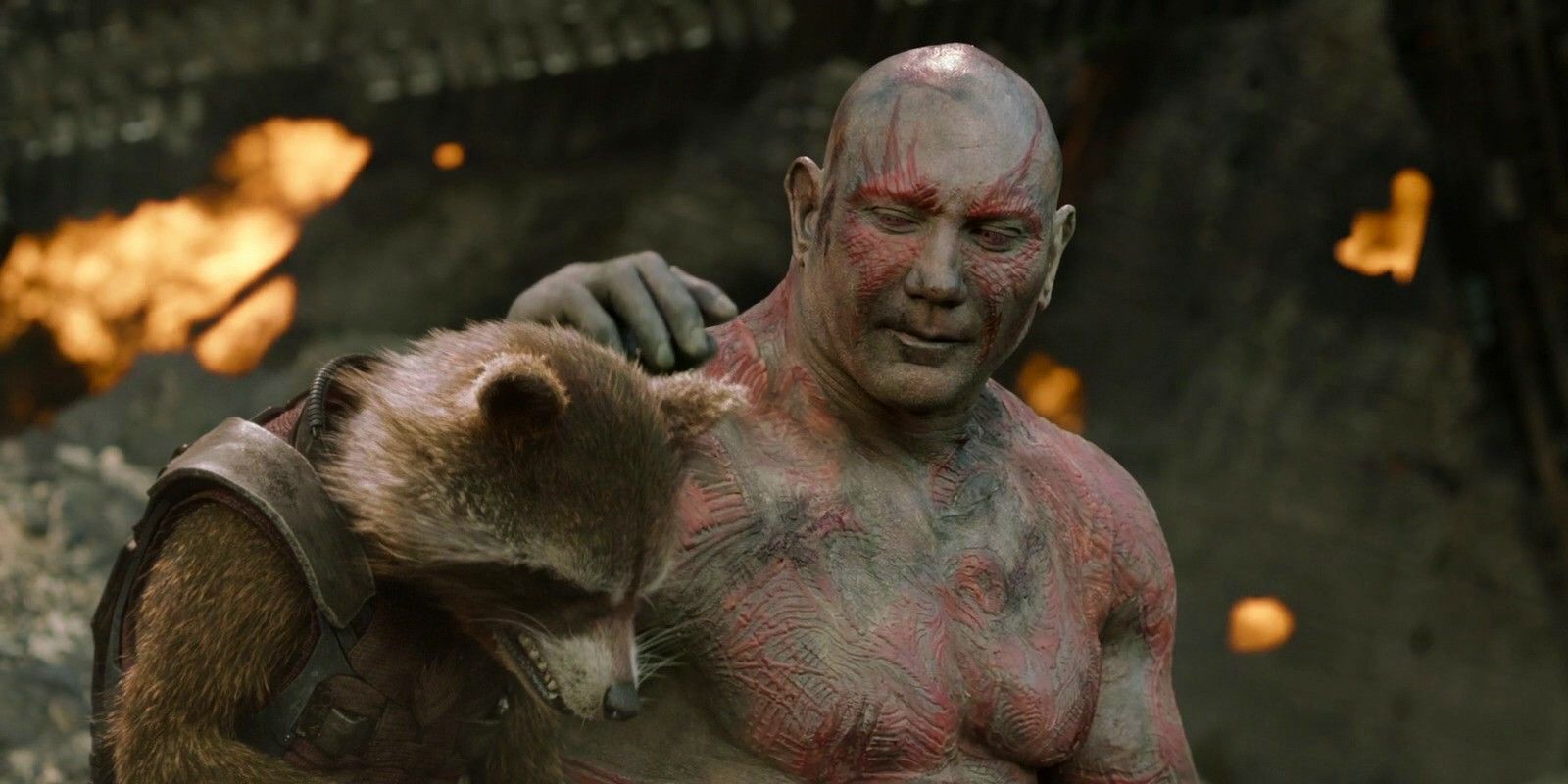 Dave Bautista as Drax comforting Rocket in Guardians of the Galaxy