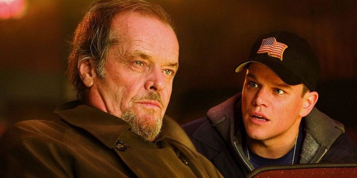 Matt Damon sits behind and looks at Jack Nicholson in The Departed