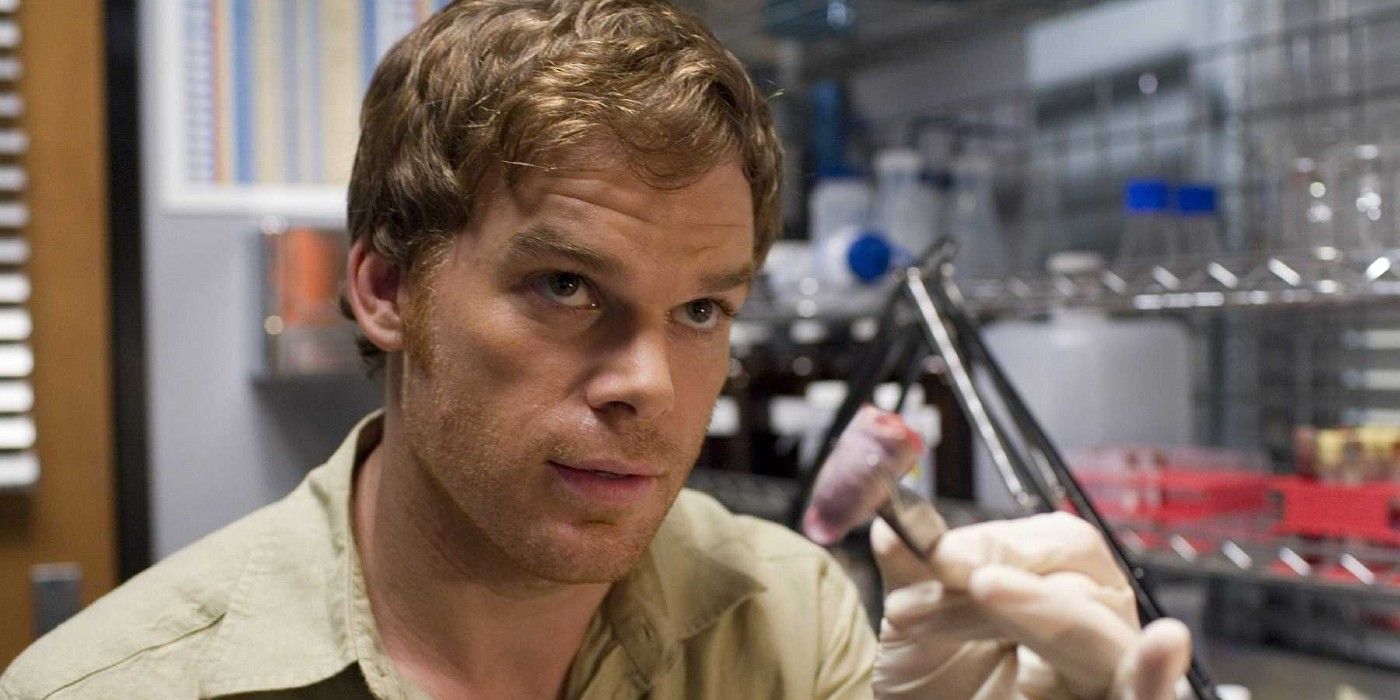 Dexter holding up a severed finger