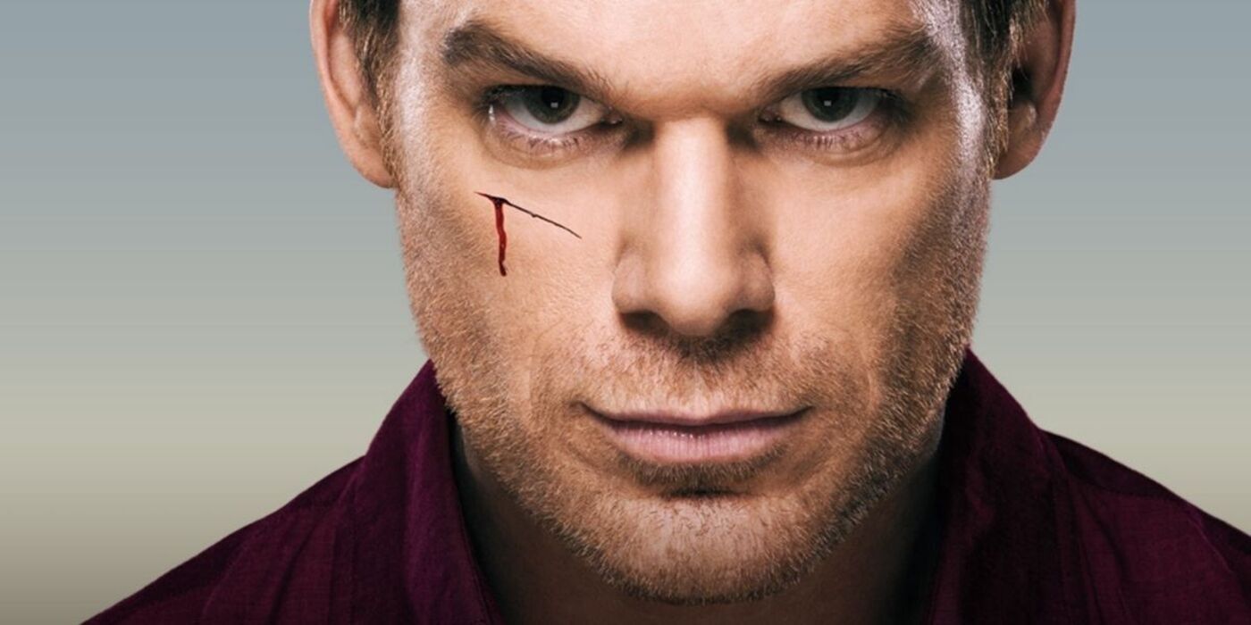 Dexter Morgan smiles with a cut on his cheek