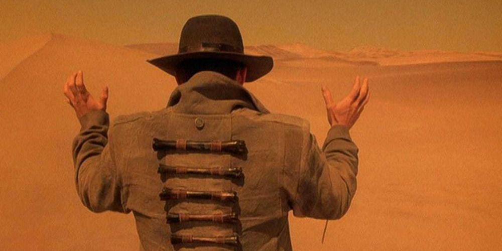 Robert John Burke looking out at a vast desert in Dust Devil (1992)