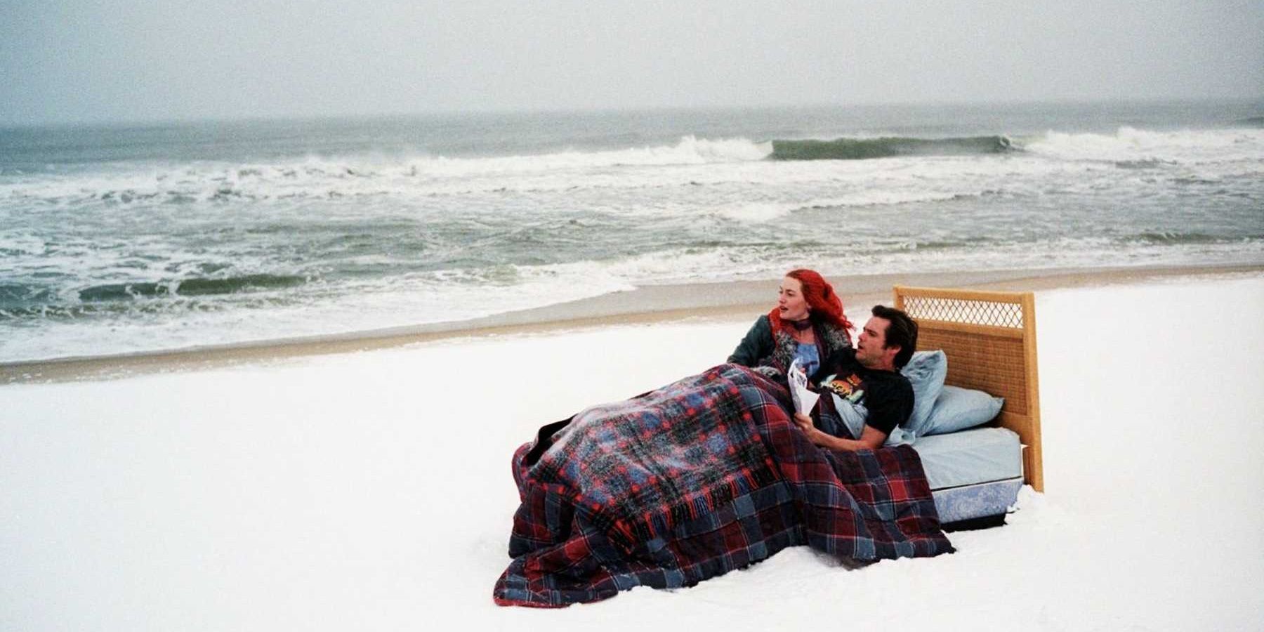 Jim Carrey and Kate Winslet in a bed on a snow-covered beach in Eternal Sunshine of the Spotless Mind.
