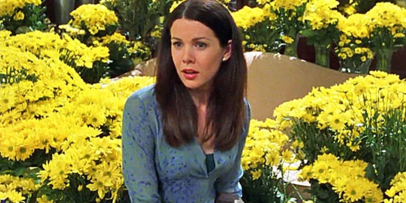 Lorelai sitting with 1,000 yellow daisies after Max proposes on Gilmore Girls
