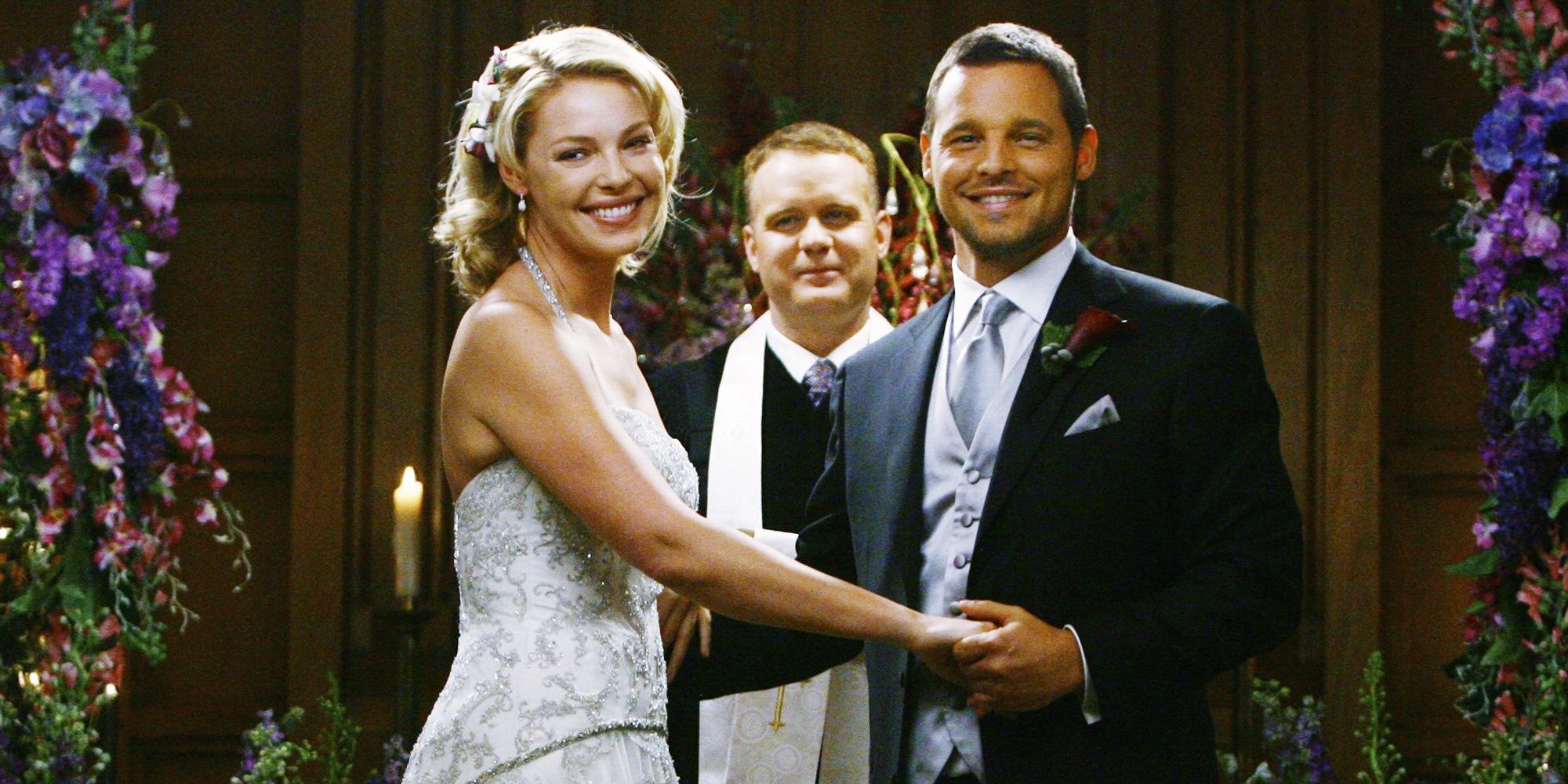 Izzie and Alex at the altar smiling in Grey's Anatomy