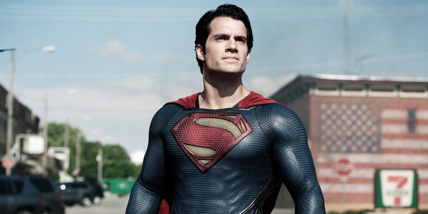 Henry Cavill's Superman standing in the middle of a town, staring up at blue sky