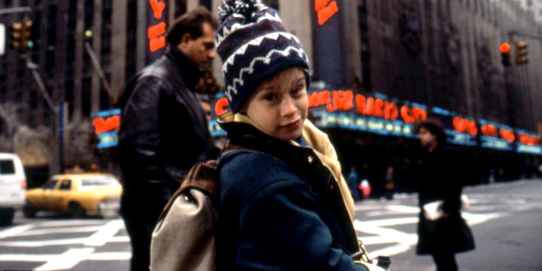 Kevin walks down the street in Home Alone 2