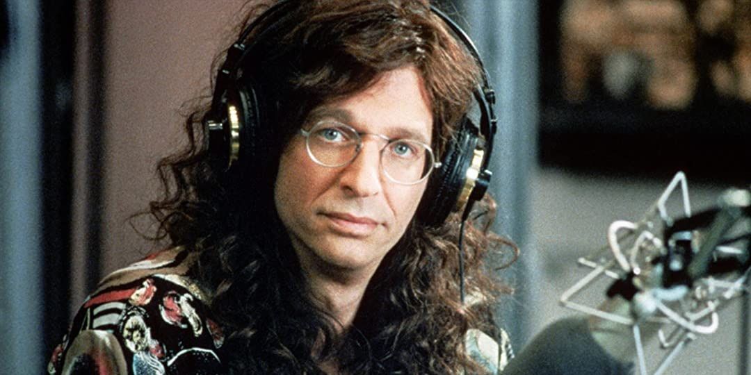 Howard Stern was headphones and speaks on air in Private Parts