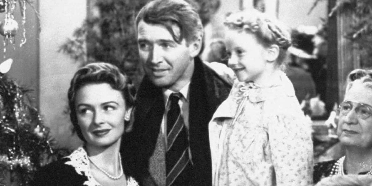 A happy family around a Christmas tree in It's a Wonderful Life