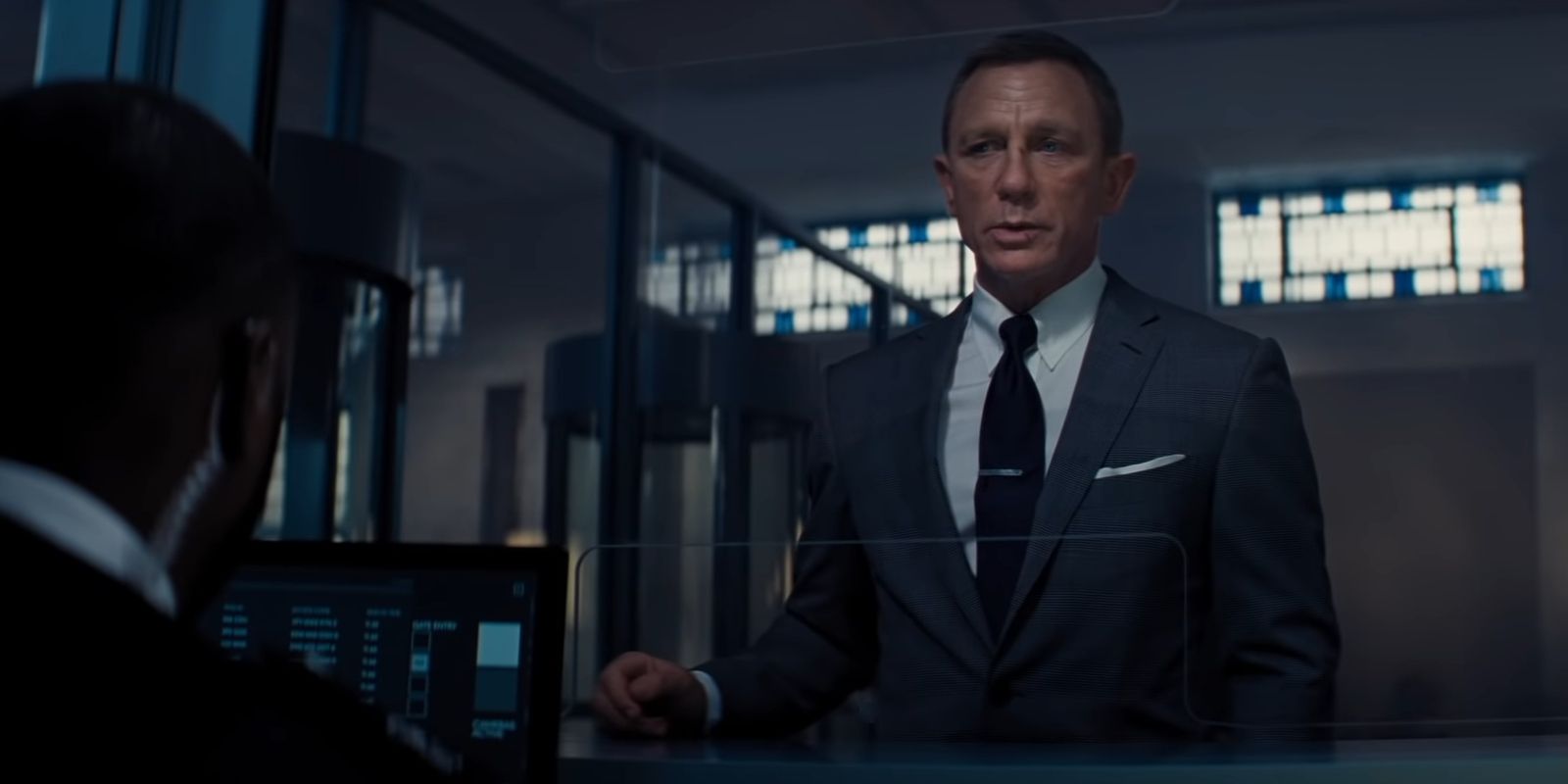 James Bond speaking to an MI6 clerk in No Time To Die