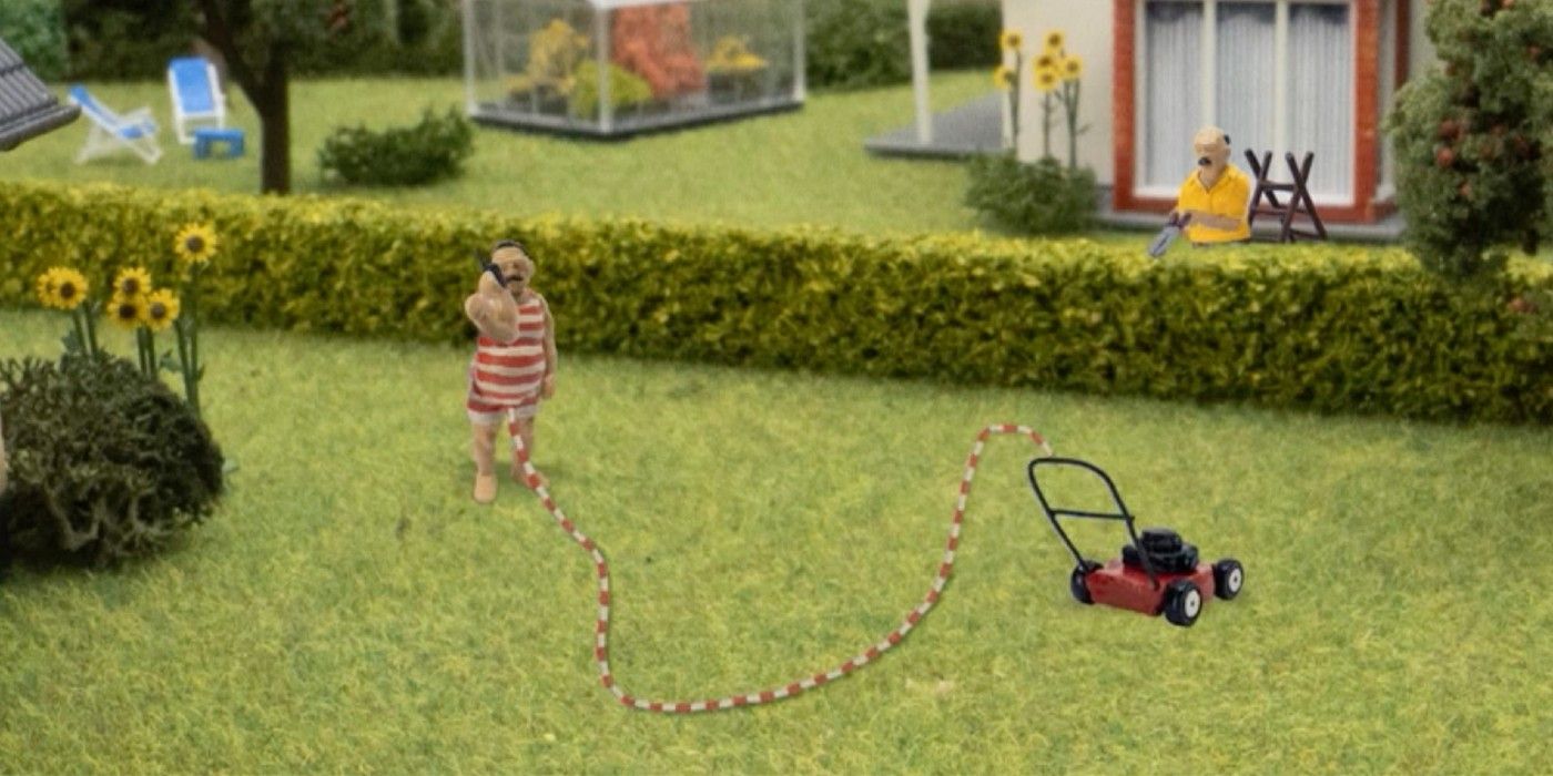 John Dillermand mowing the lawn