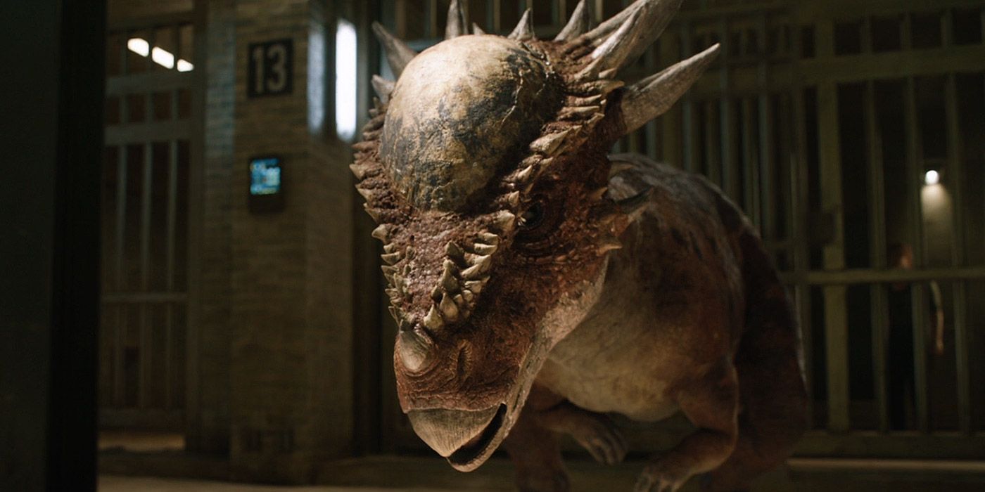 A Stygimoloch rams through a jail cell in Jurassic World: Fallen Kingdom