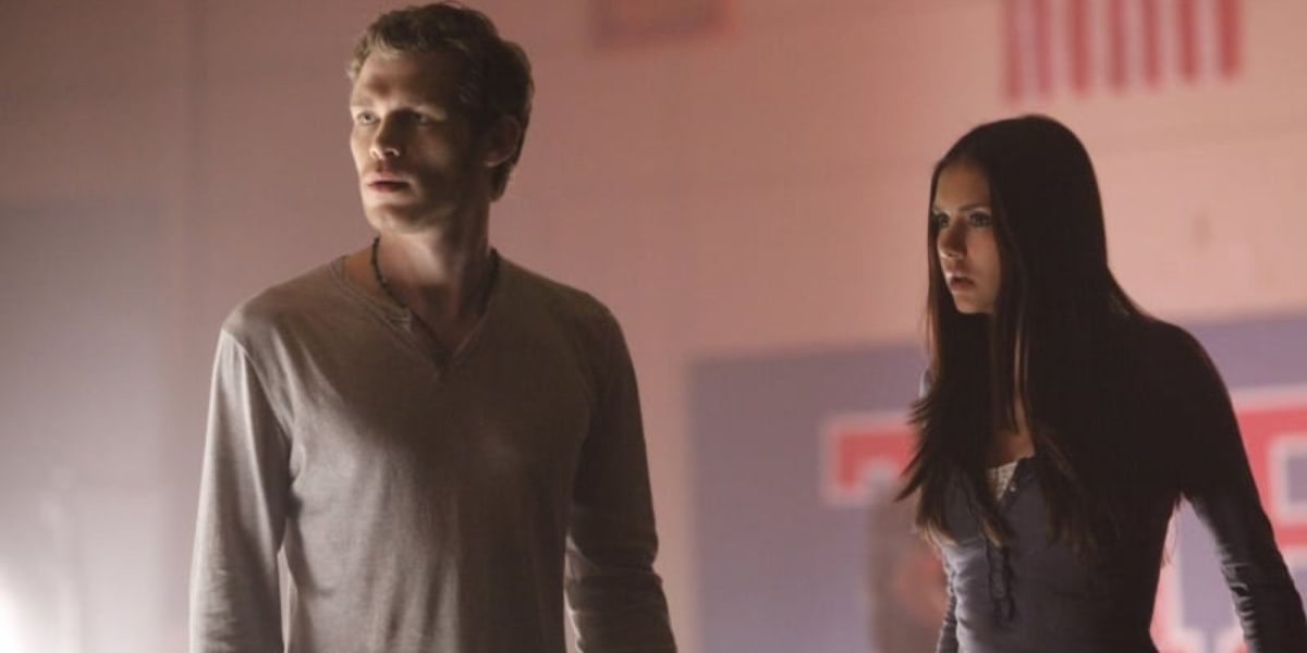 Klaus and Elena stand together in The Vampire Diaries