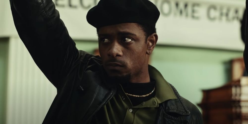 LaKeith Stanfield raising his fist in a still from Judas and the Black Messiah