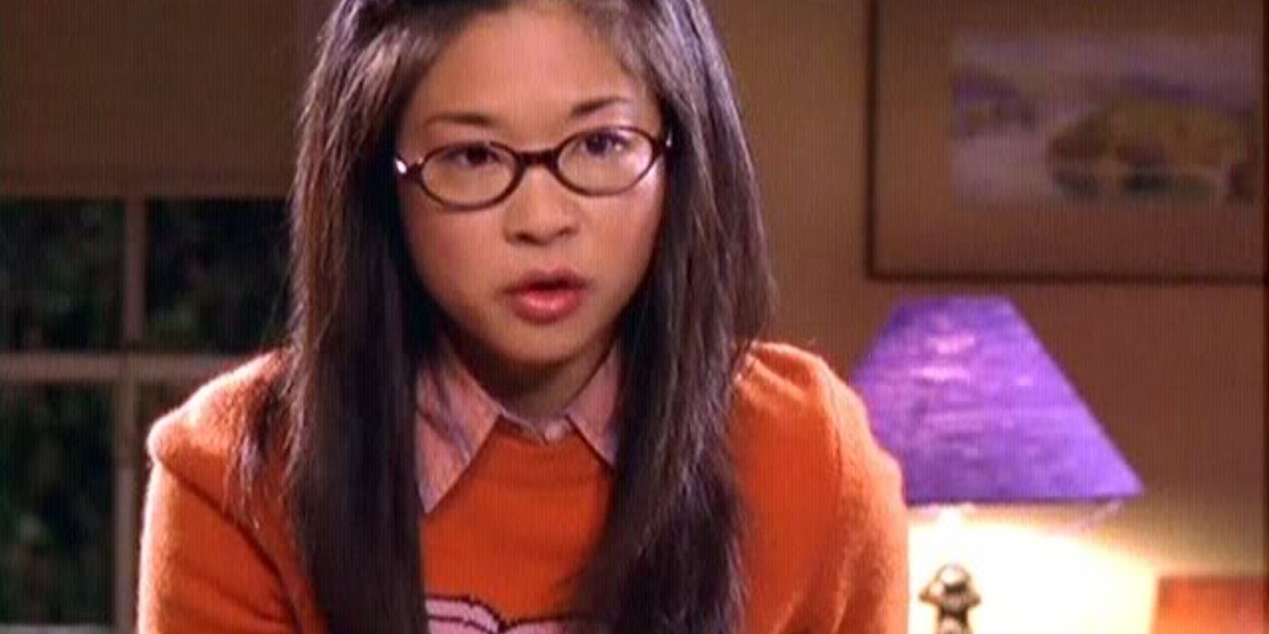 Lane Kim wearing an orange sweater on Gilmore Girls