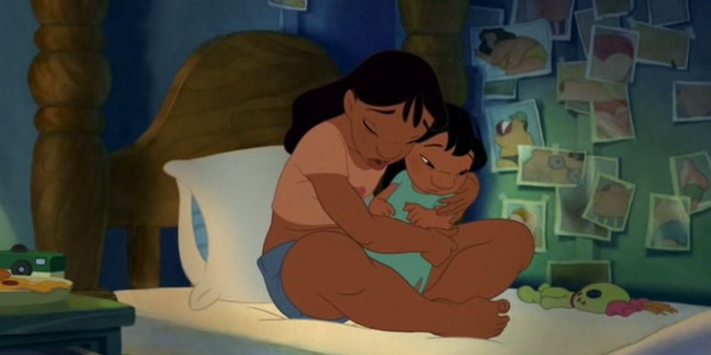 Lilo and Nani higging on the bed in Lilo and Stitch (2002)