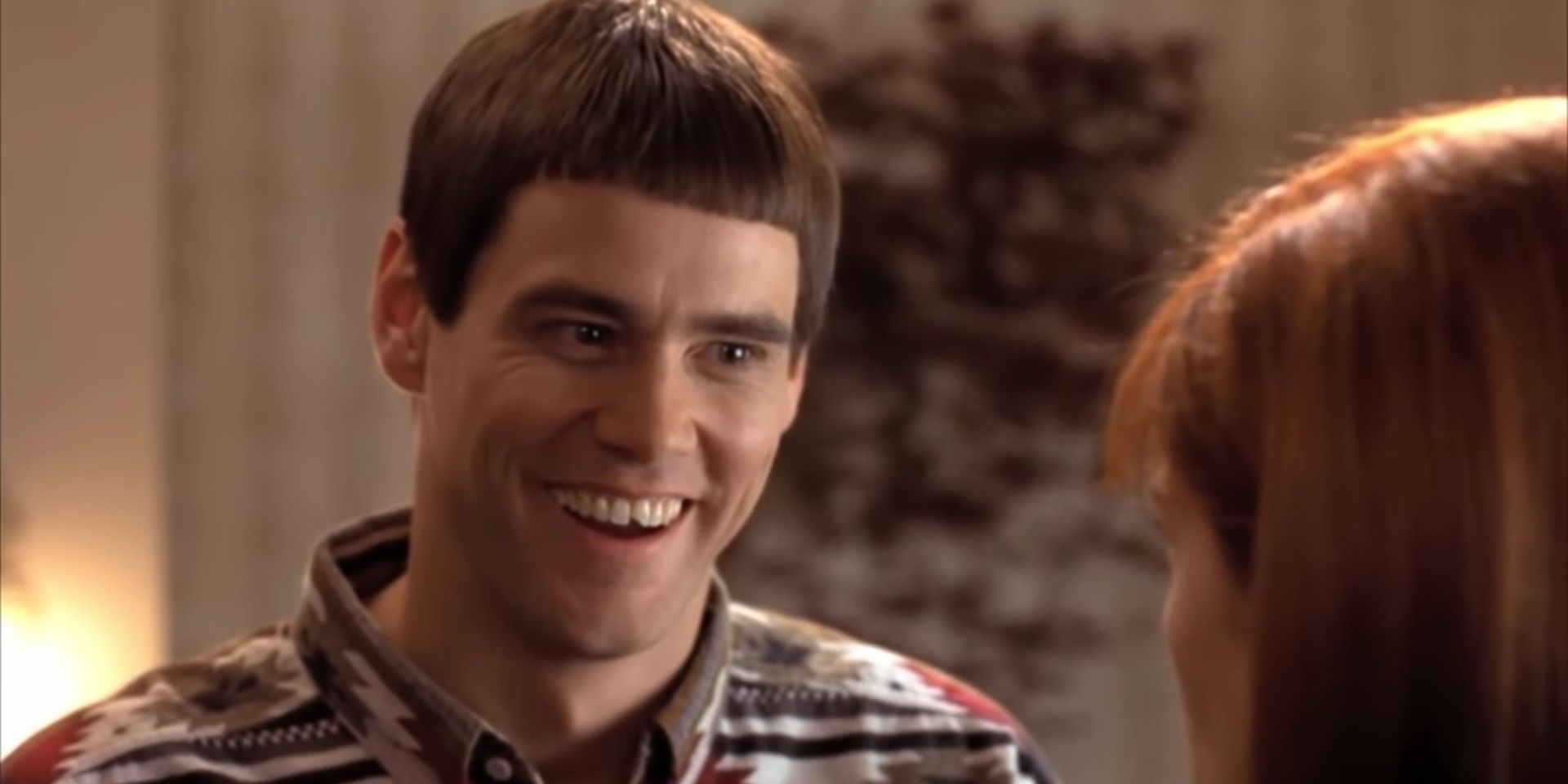 Lloyd in Dumb and Dumber smiling at Mary