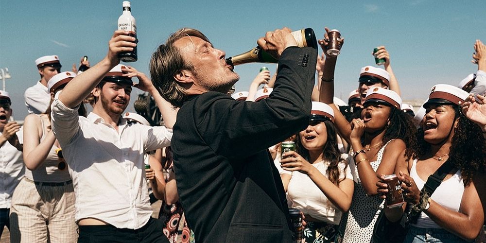 Mads Mikkelsen drinking champagne in Another Round