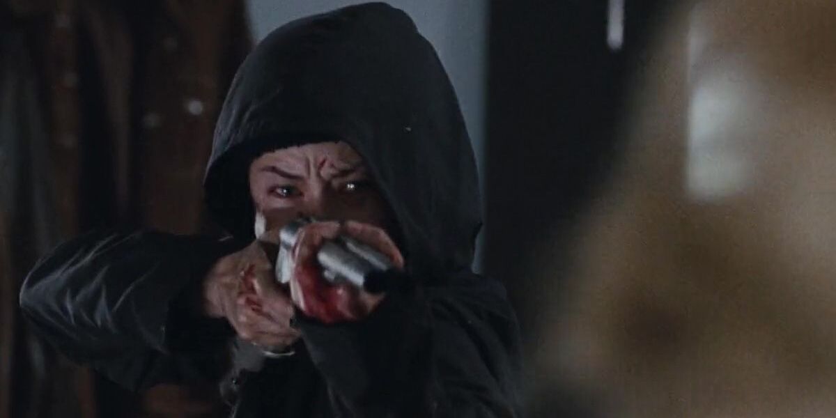 Opening scene from Martyrs with woman holding shotgun