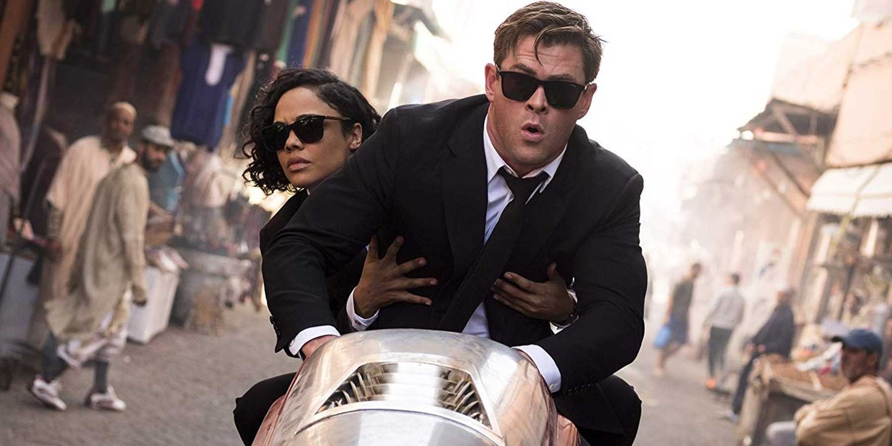 M and H riding a bike in Men in Black International