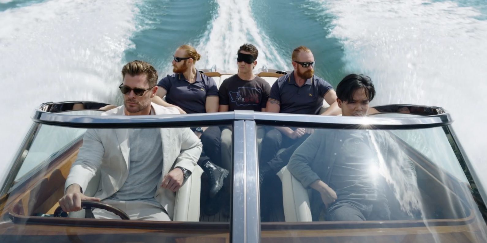 Chris Hemsworth on a speedboat in Escape from Spiderhead on Netflix