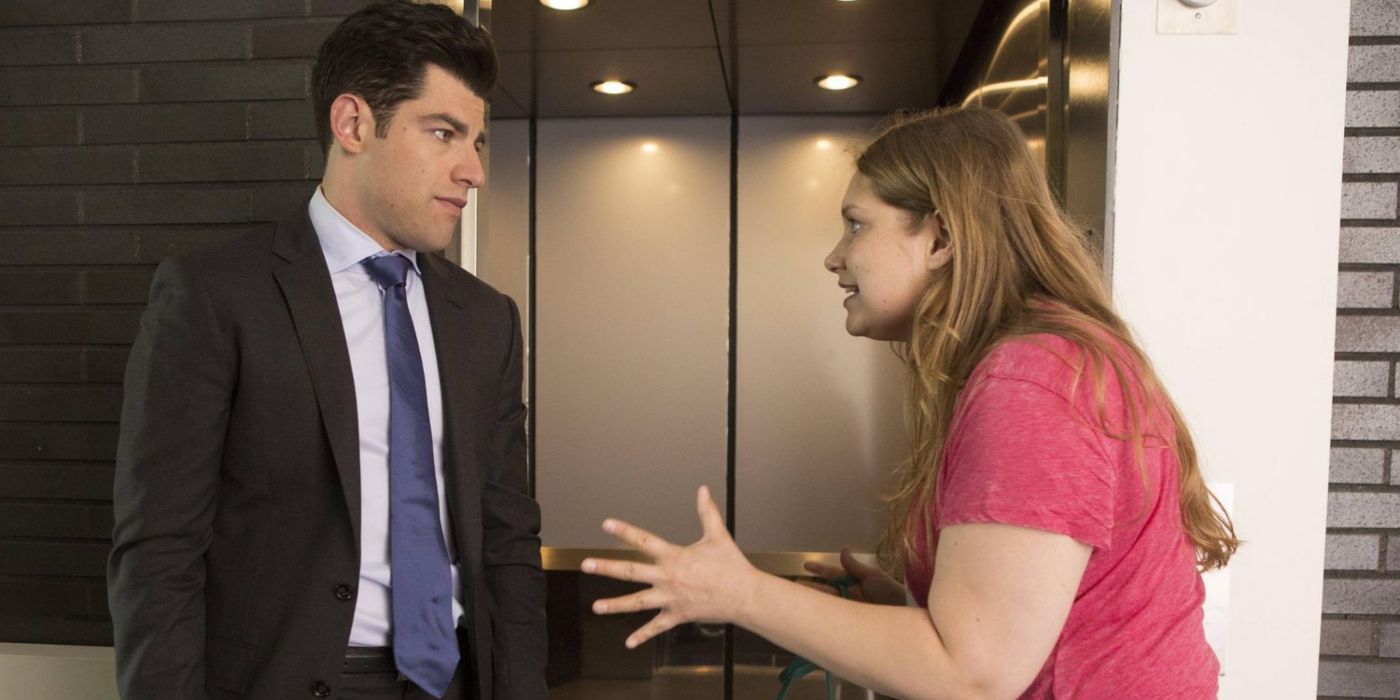 Schmidt and Elizabeth argue at the elevator in his workplace in New Girl