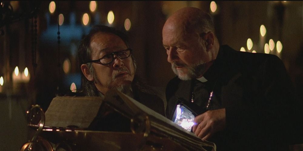 Donald Pleasance and Victor Wong reading a sacred text in Prince of Darkness