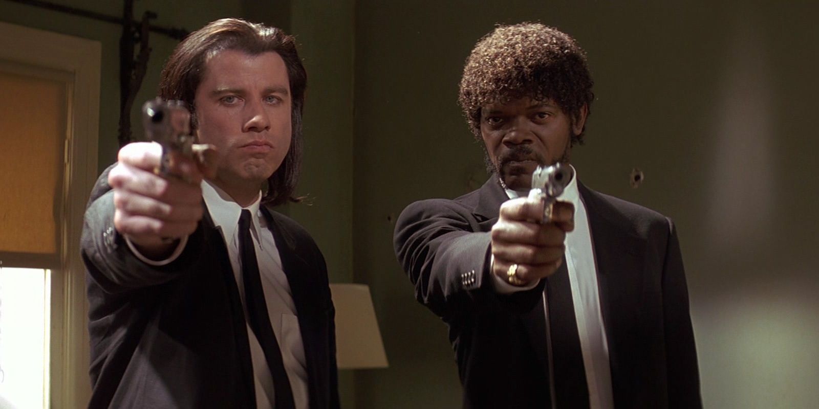 Vincent and Jules pointing their guns in the same direction in Pulp Fiction