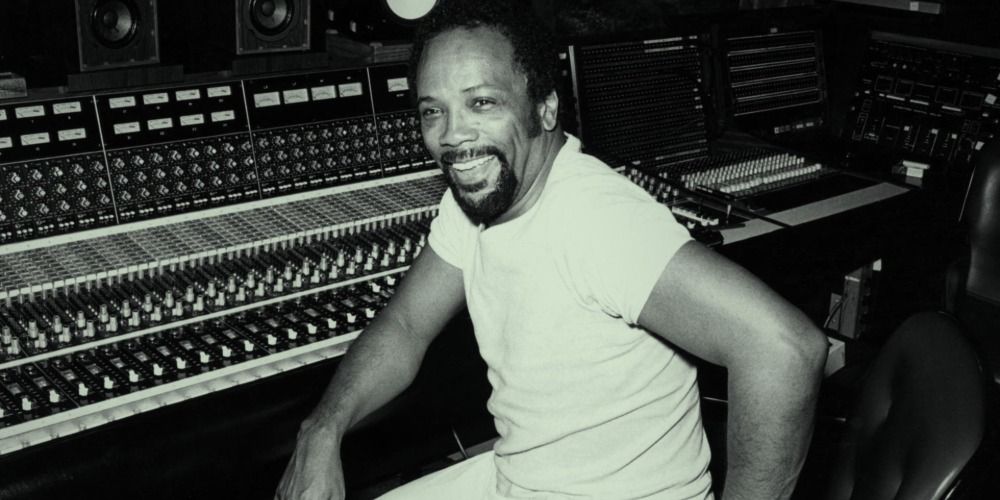 Quincy Jones smiling in the recording studio