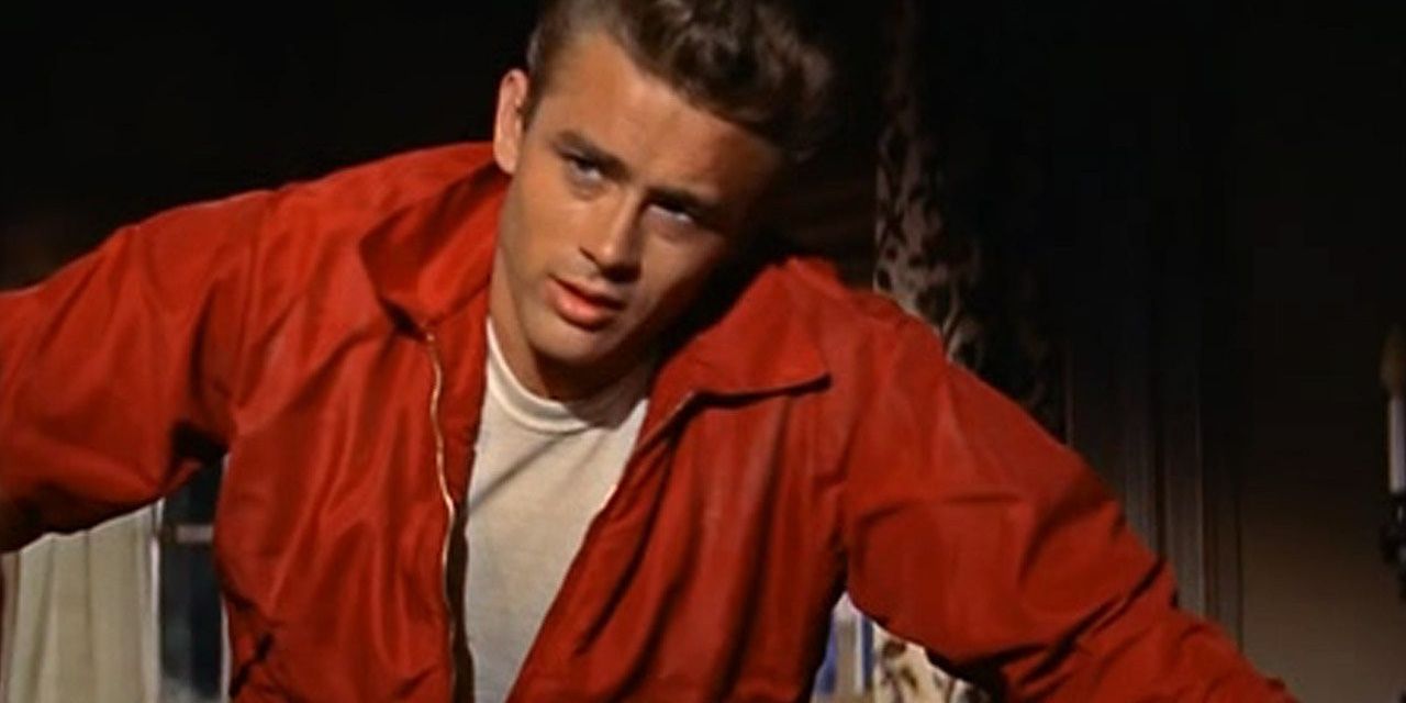 James Dean wearing a red jacket in Rebel Without a Cause