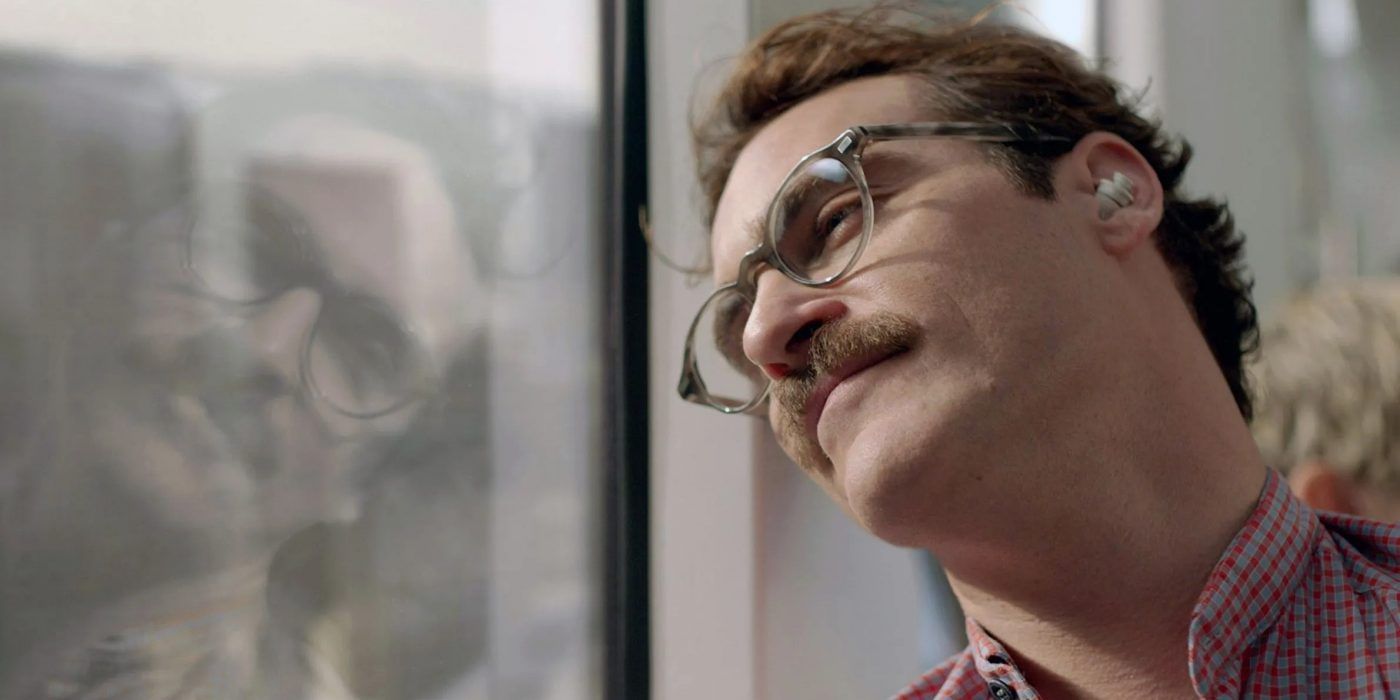 Joaquin Phoenix gazing out of a window in Her
