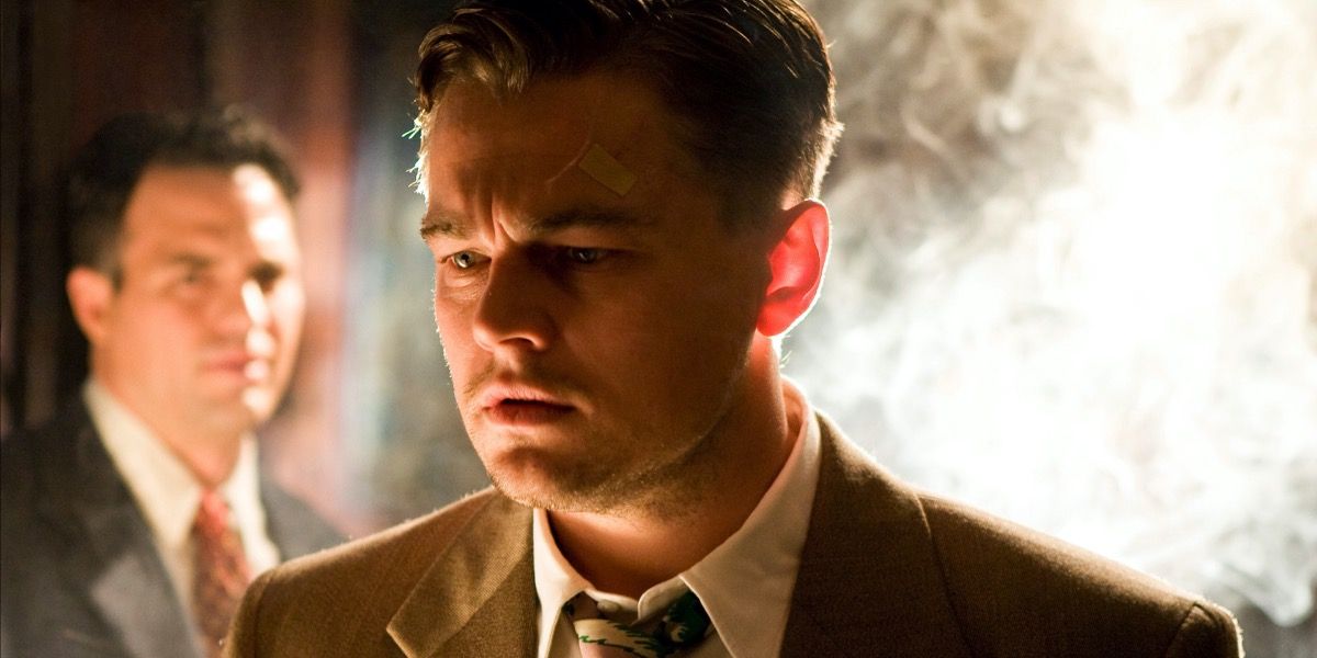 Teddy looking confused while Chuck stands behind him in Shutter Island