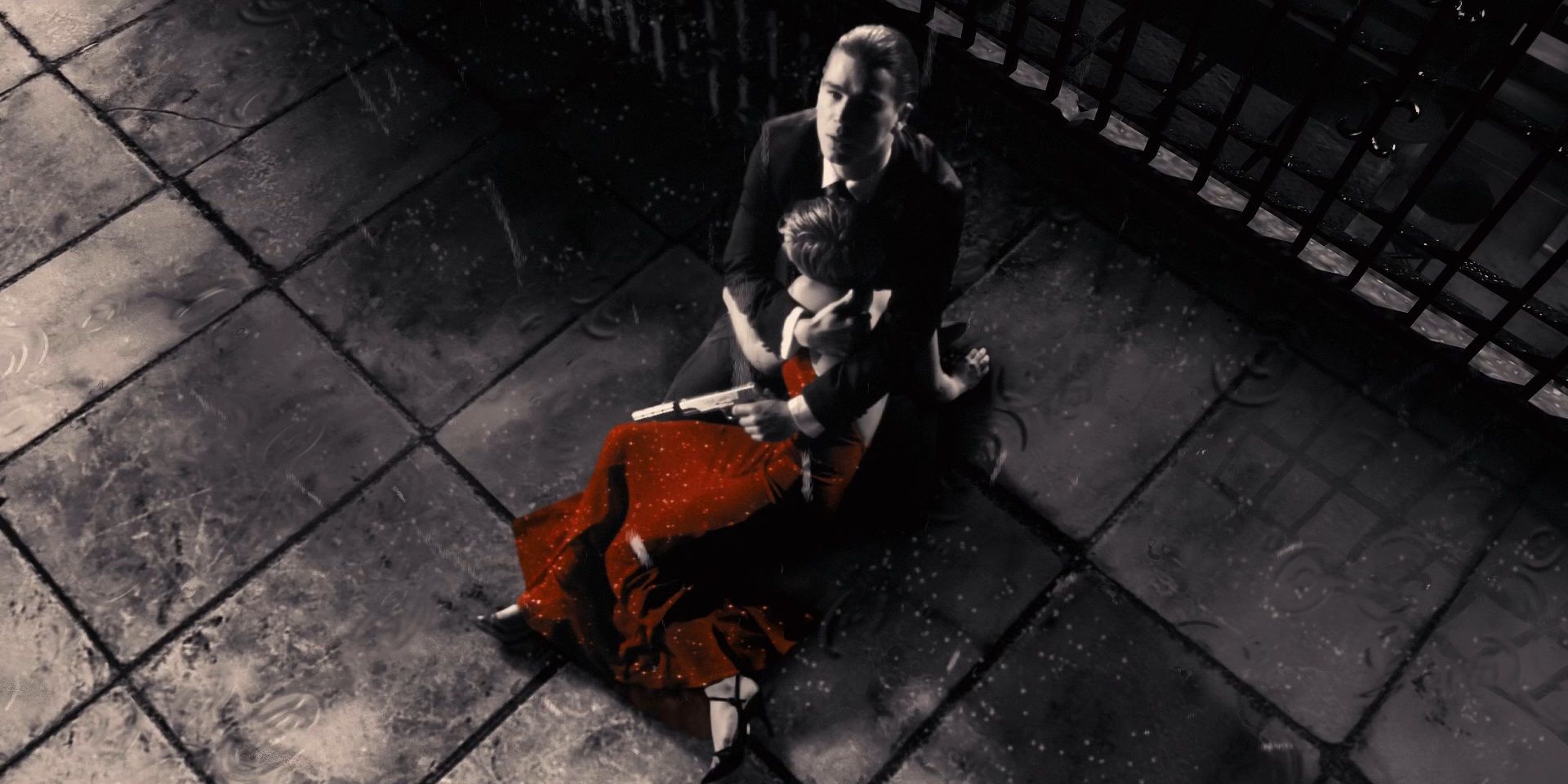 Josh Harnett in Sin City scene holding the Lady in The Red Dress