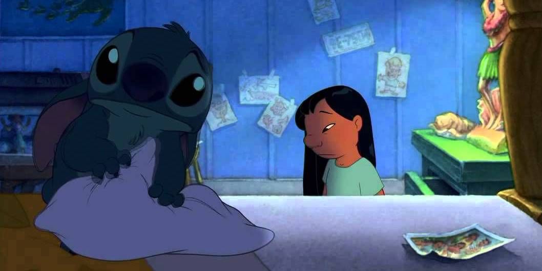 Stitch looking sad on the bed in Lilo and Stitch (2002)