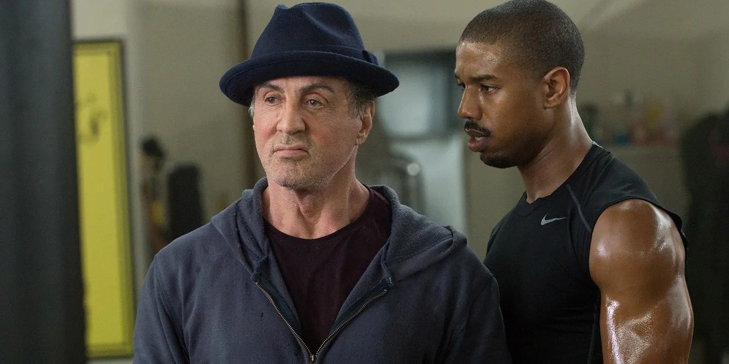 Rocky Balboa (Sylvester Stallone) and Adonis Creed (Michael B. Jordan) in Creed (2015).