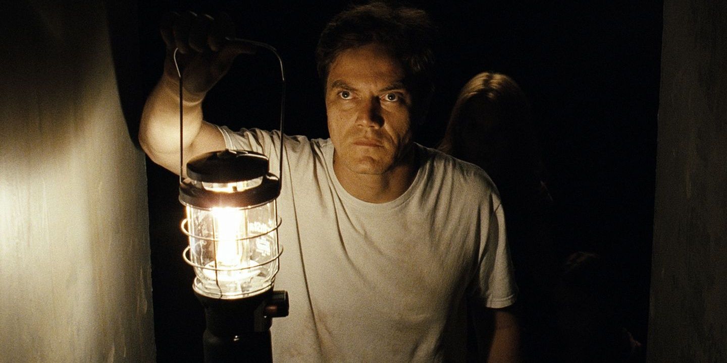 Michael Shannon holds a lantern in Take Shelter