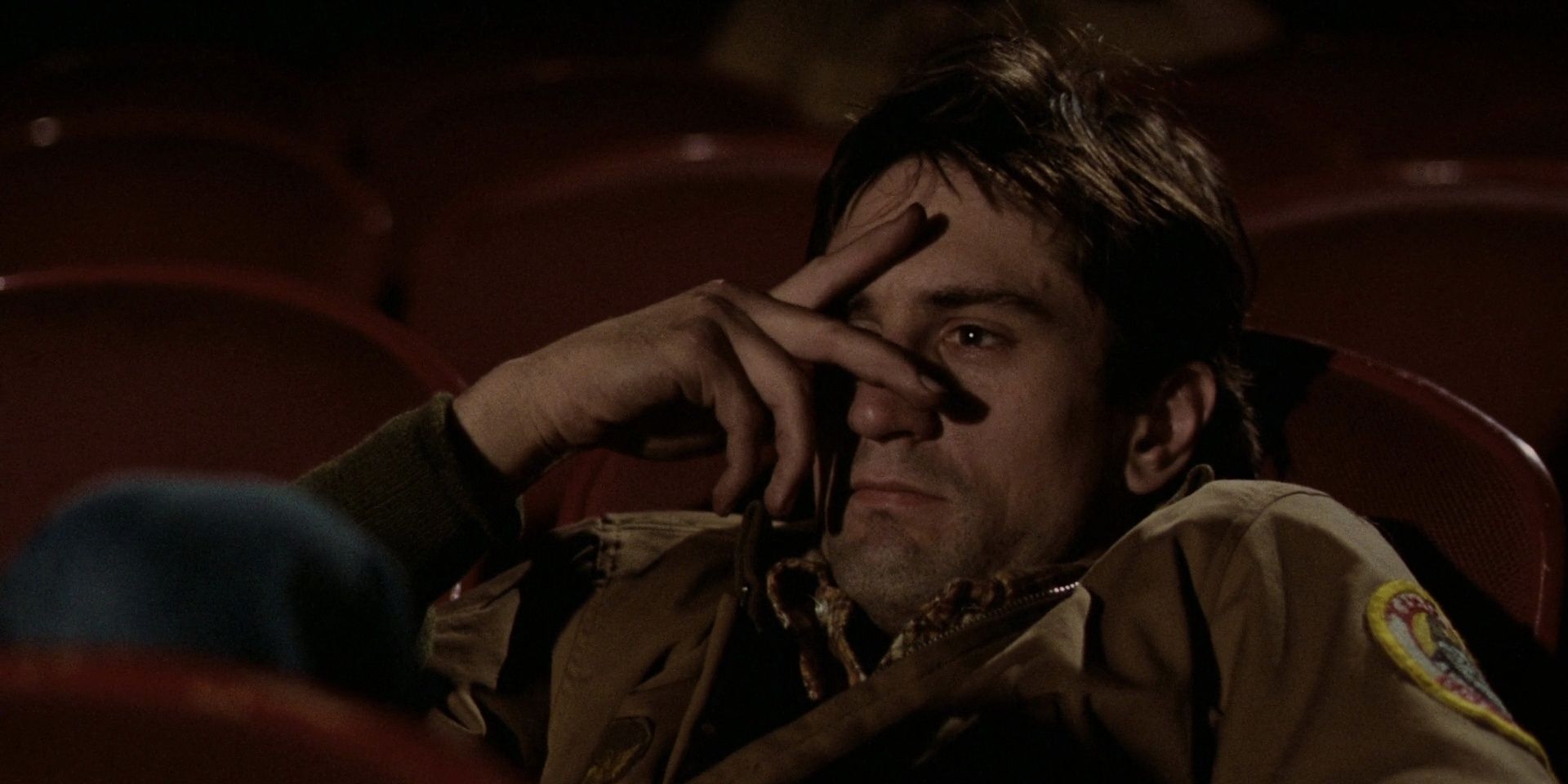 Travis Bickle at the movies in a still from Taxi Driver