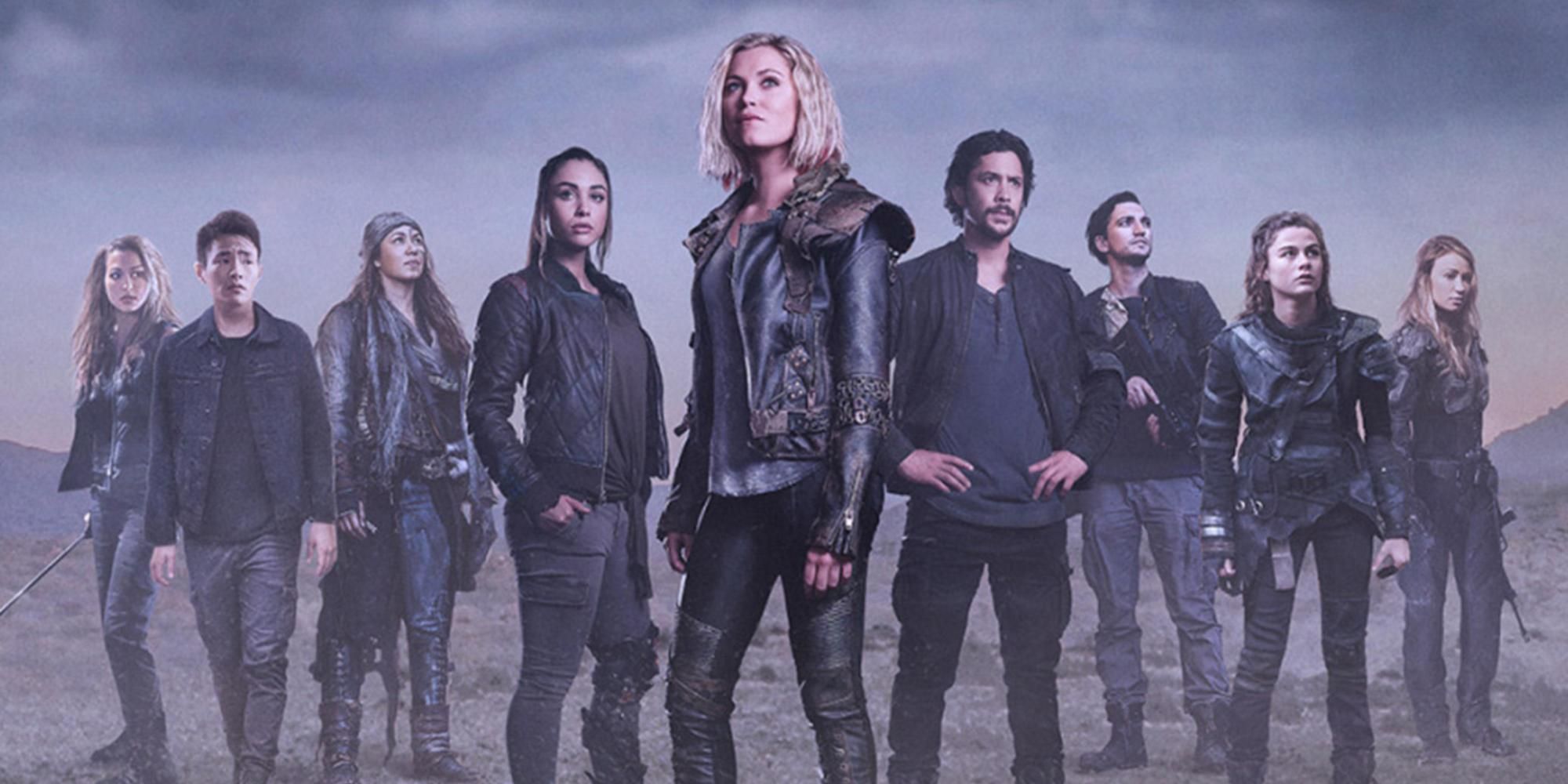 The cast of The 100 with Clarke Griffin and Bellamy Blake in the middle