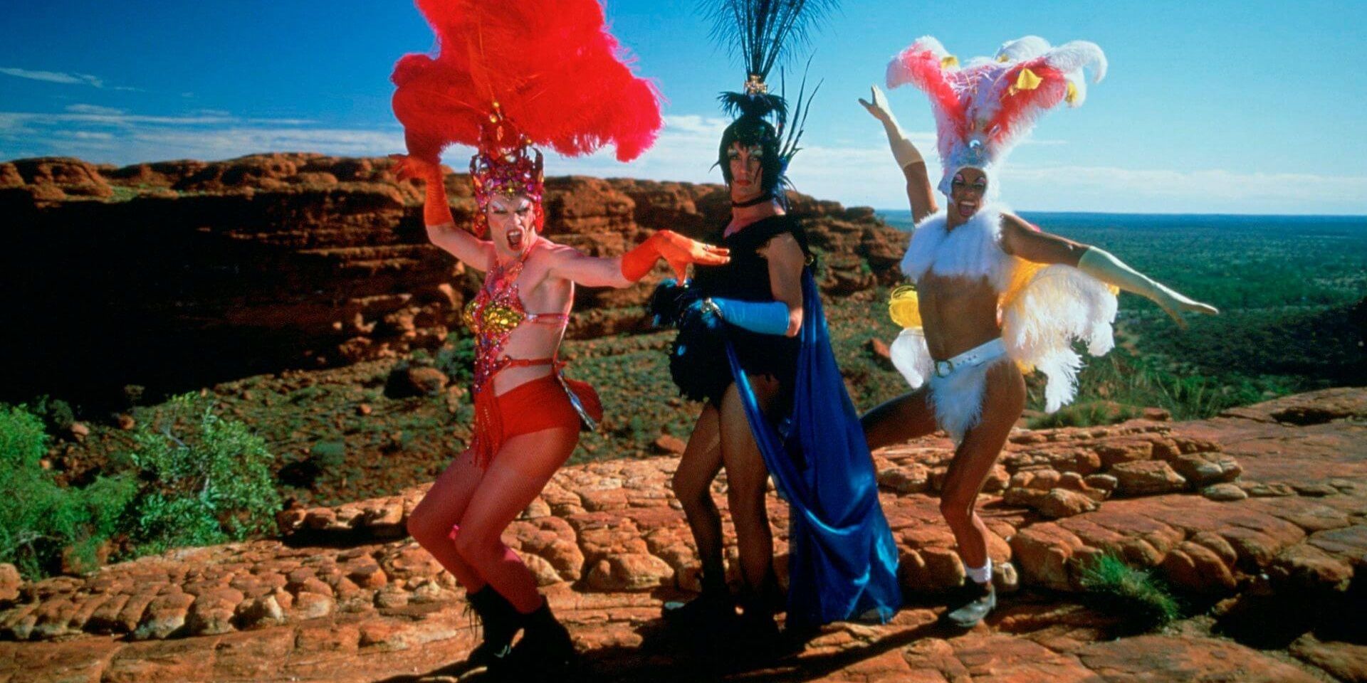 Mitzi, Bernadette, and Felicia posing in the desert in The Adventures of Priscilla Queen of the Desert