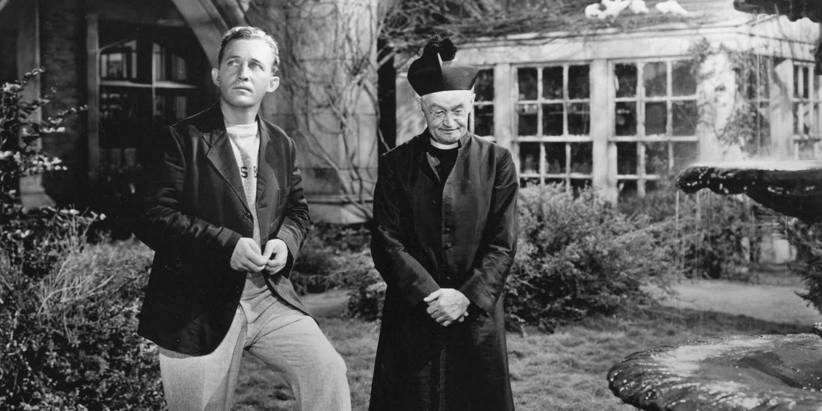 A black and white image of Father Chuck O'Malley (Bing Crosby) in The Bells of St. Mary's (1945).