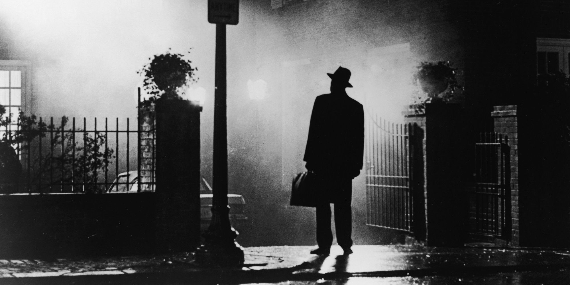 Father Merrin stands outside the house in The Exorcist