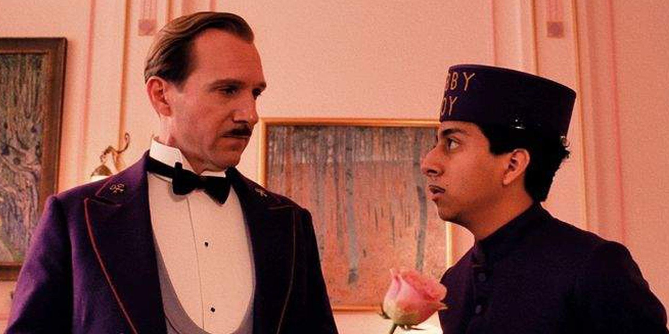 Ralph Fiennes and Tony Revolori looking at each other The Grand Budapest Hotel