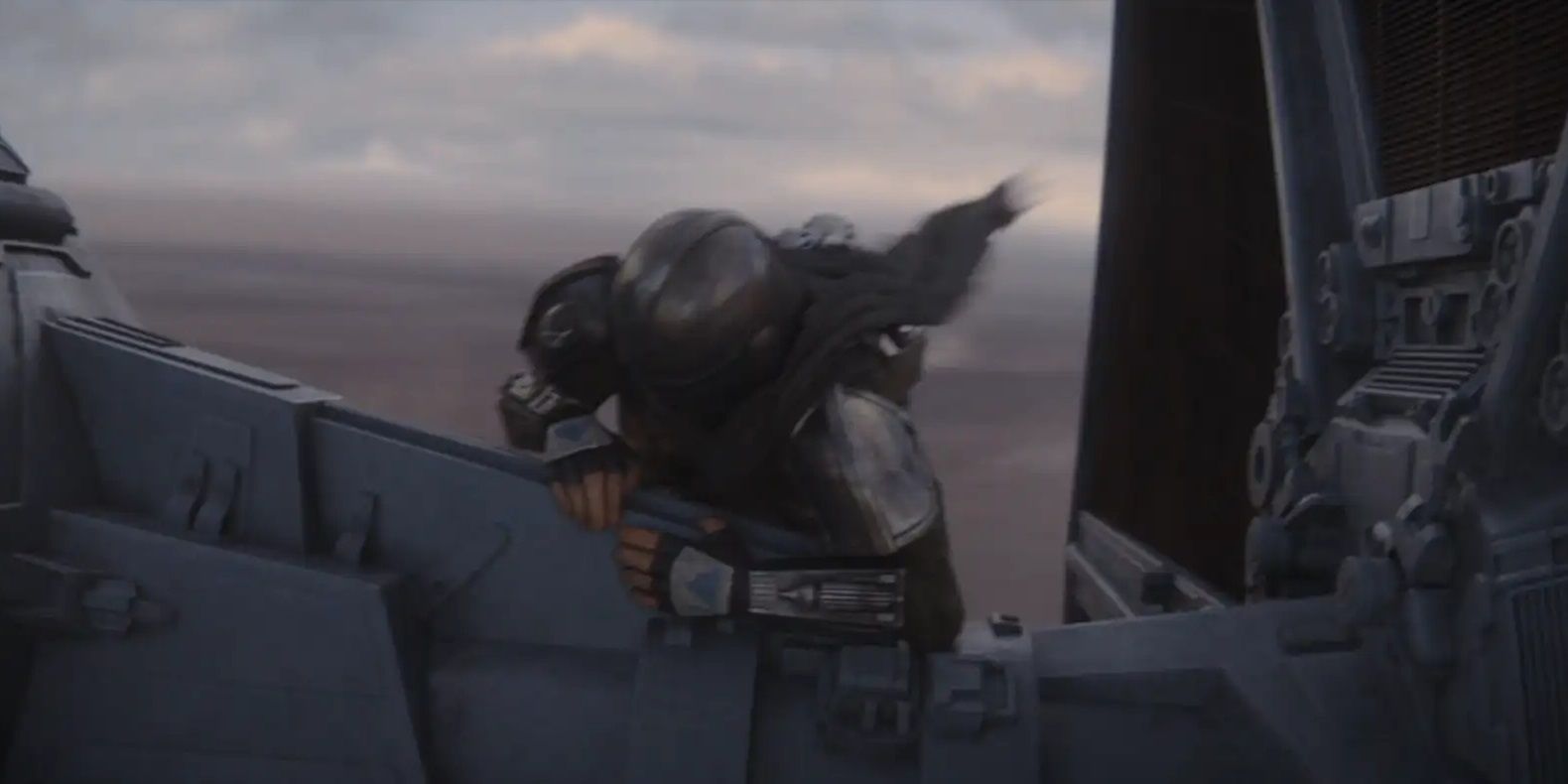 The Mandalorian on the wing of a TIE fighter