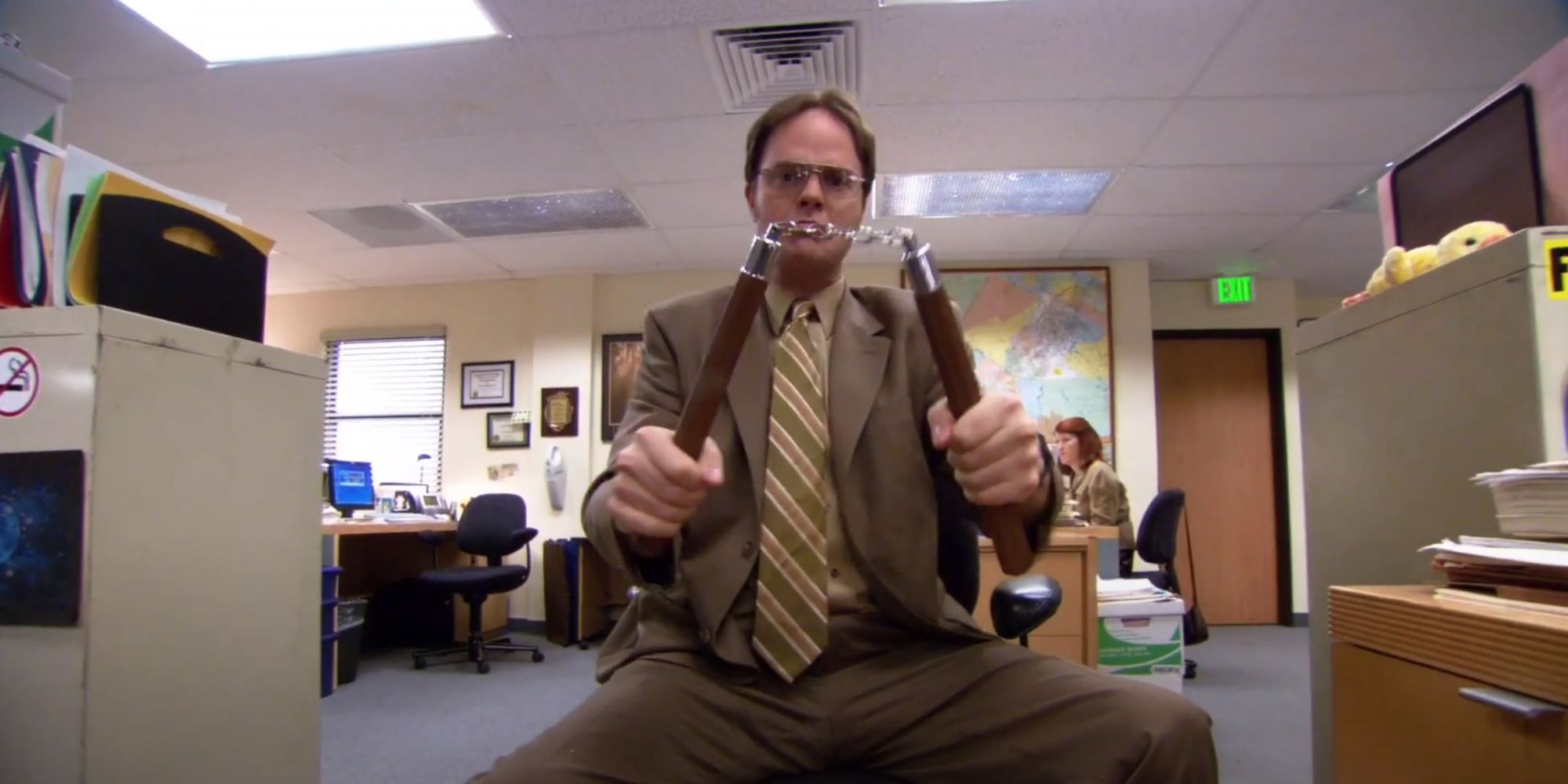 Dwight shows off his weapons hidden around the office in The Office