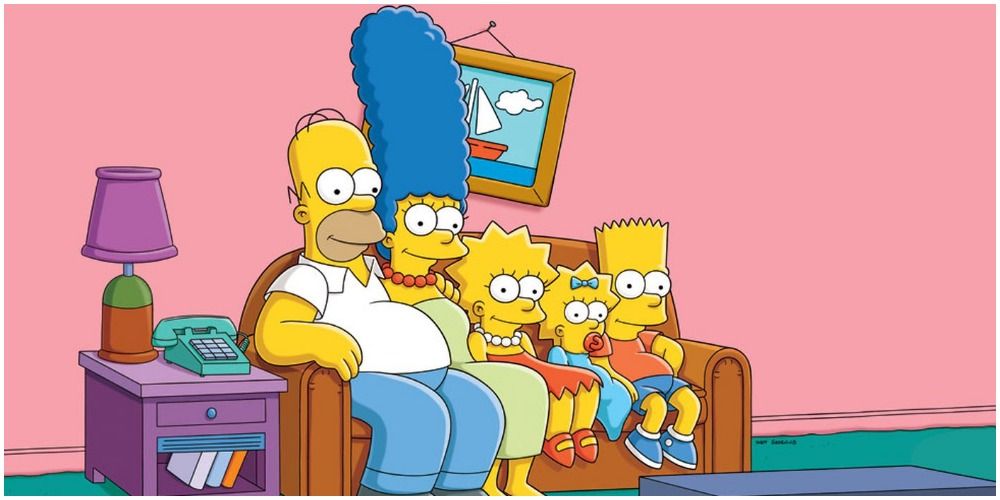 The Simpsons sit on their couch and watch TV