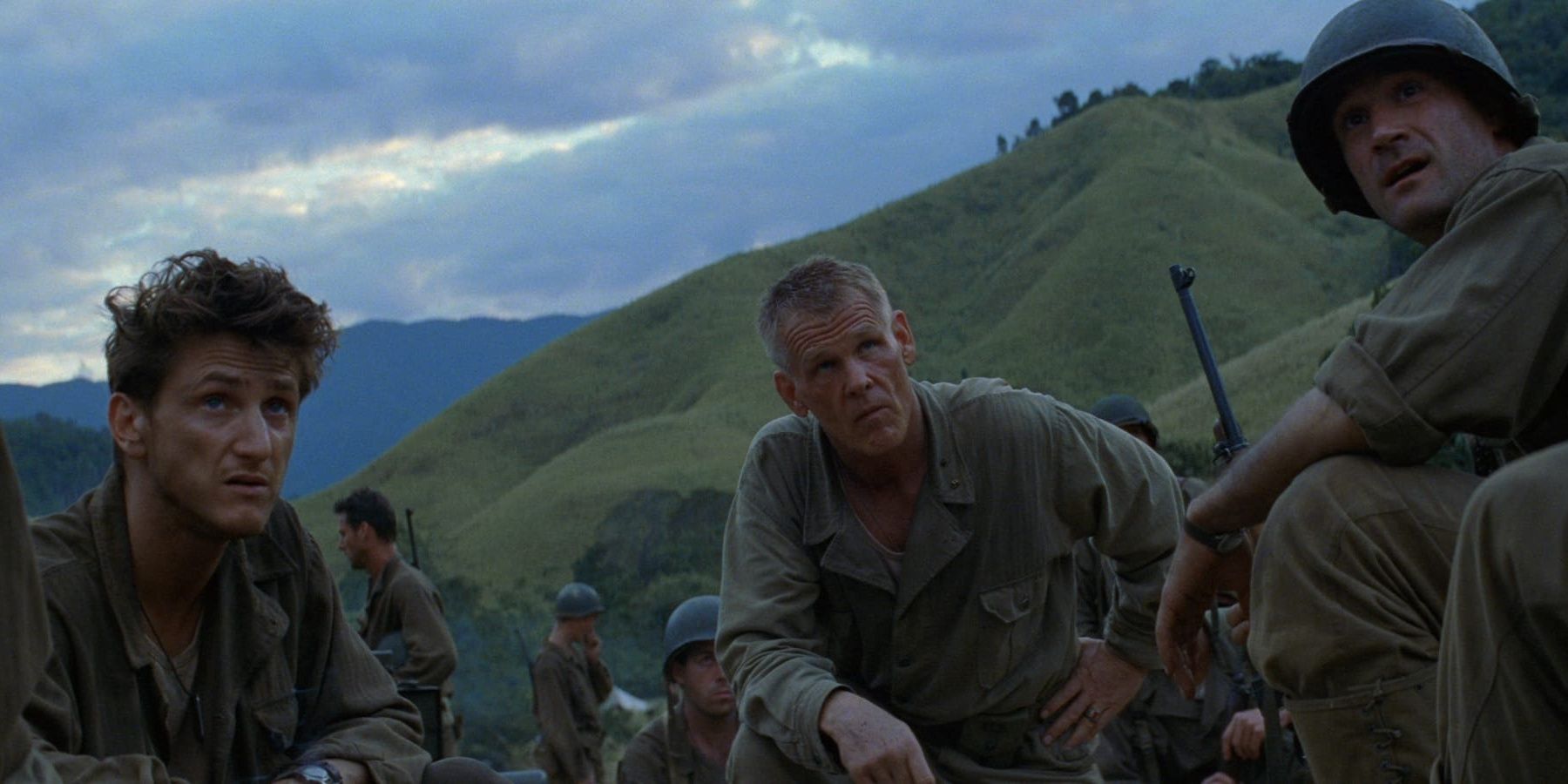 Sean Penn, Nick Nolte, and Elias Koteas on a battlefield in The Thin Red Line