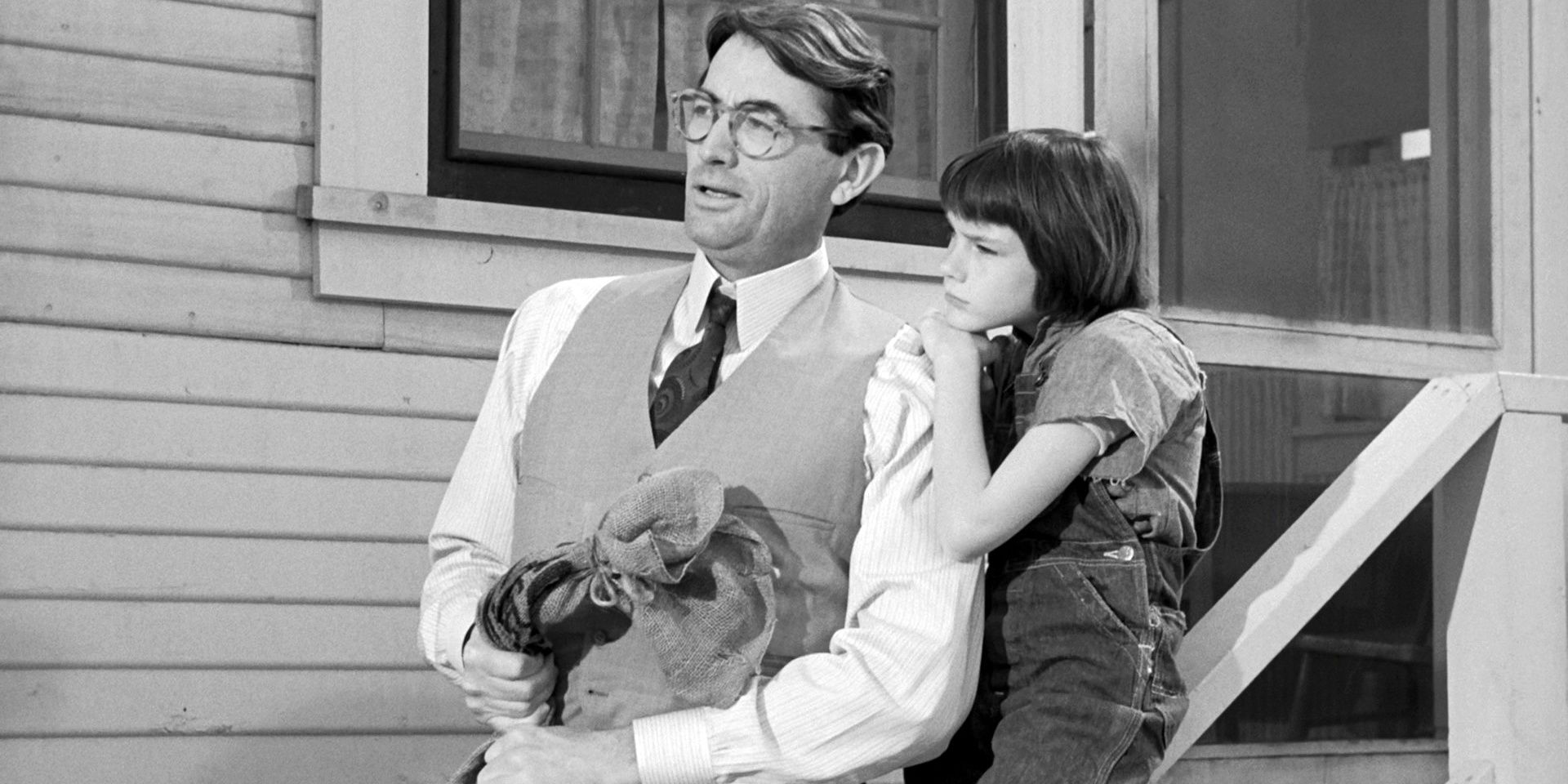 Atticus and Scout together on the porch in To Kill A Mockingbird