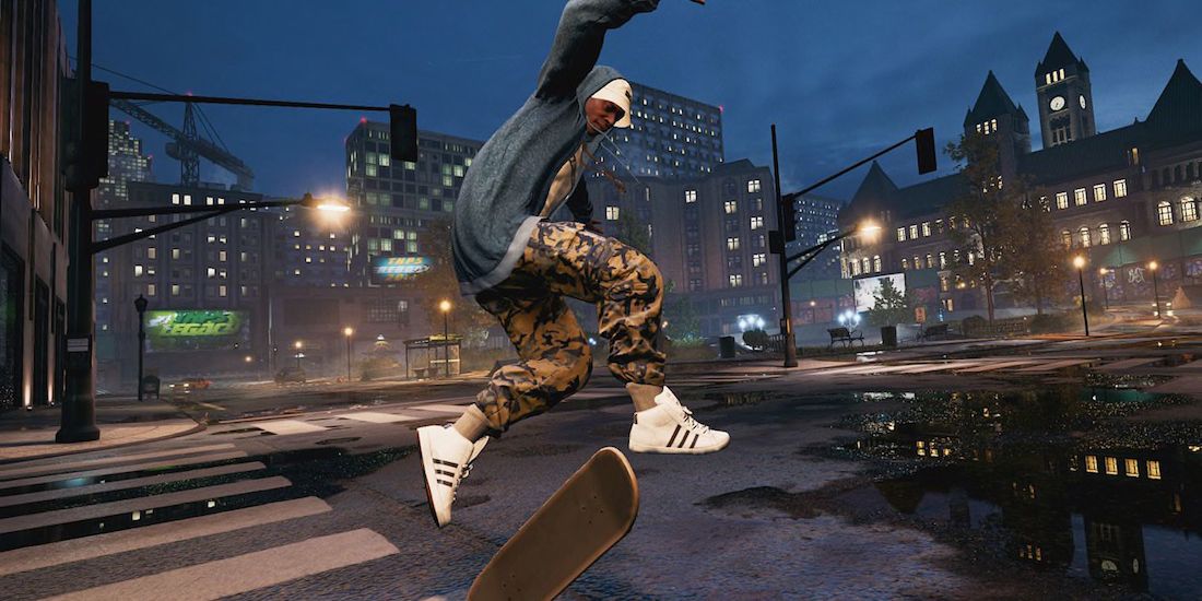 The skater kick flips across the street at night in Downtown in Tony Hawk’s Pro Skater 1+2