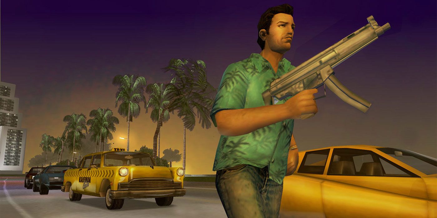 Tommy wields a gun while running down the road in GTA: Vice City.