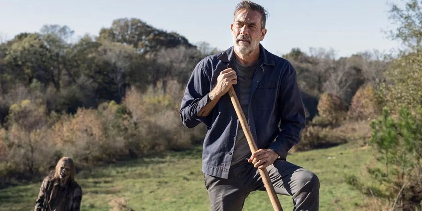 Negan digging in a field in The Walking Dead